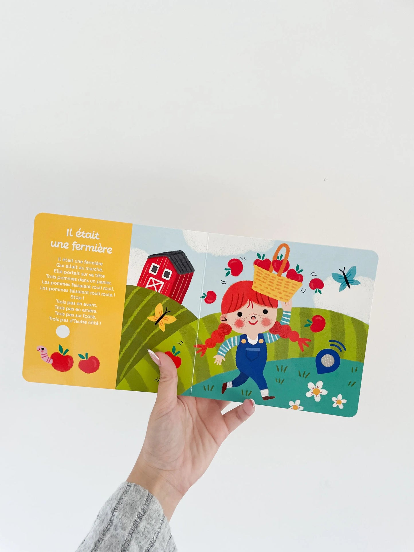 Livre sonore bébé dès 12 mois - Mes comptines de la ferme. Page intérieur sur la fermière. comptines pour enfant